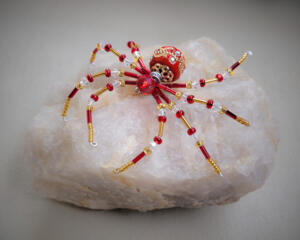 red and gold beaded spider ornament, sparkling accents, decorative focal bead. Handcrafted wire legs create a warm, festive, magical look.